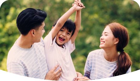 Smiling and laughing family enjoying their time in a park